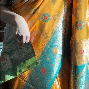 Vibrant Orange and Teal Floral Benarasi drape Saree